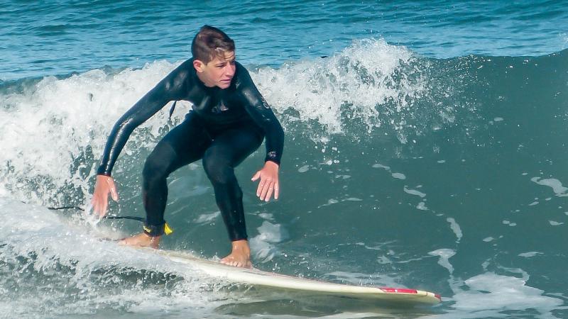 Henry Boeger surfing longboard at Pacifica