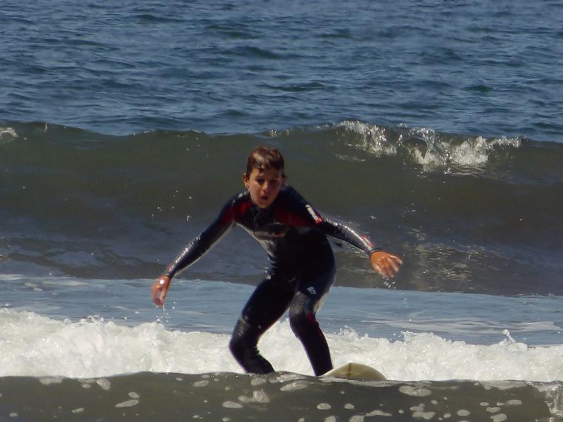 Simon surfing at Stinson.